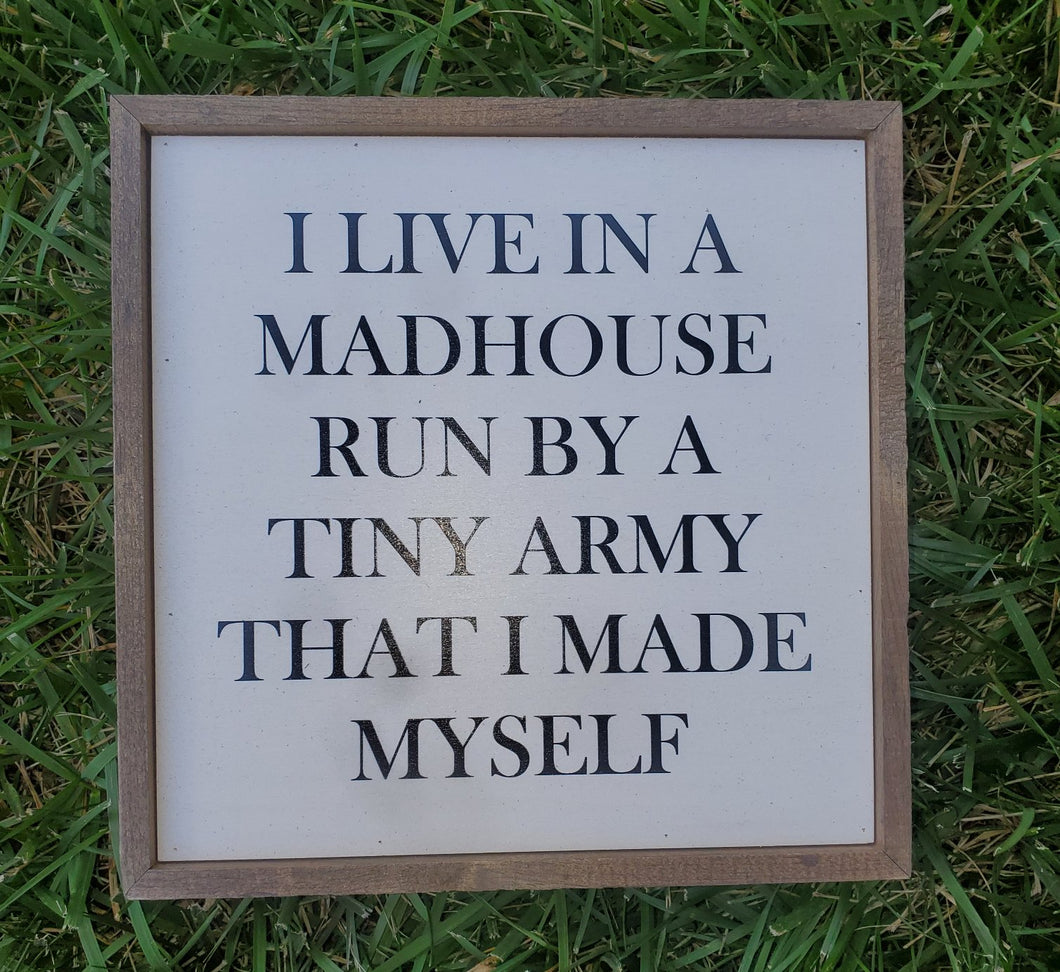 Madhouse Run By a Tiny Army Sign
